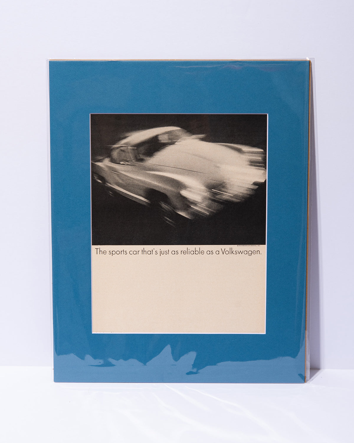 "The sports car that's just as reliable as a Volkswagen" original vintage mated Karmann Ghia ad