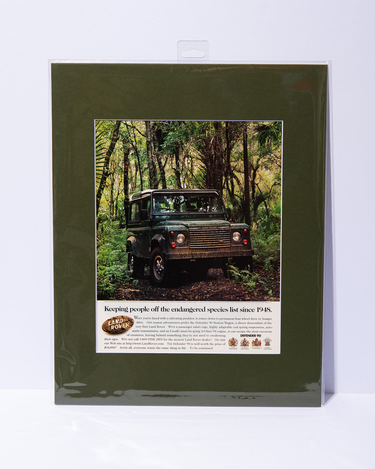 Land Rover Defender 90 "Keeping people off the..." original vintage mated advertisement