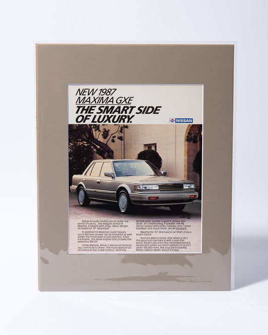 1987 Nissan Maxima GXE "The smart side of luxury" original vintage mated ad